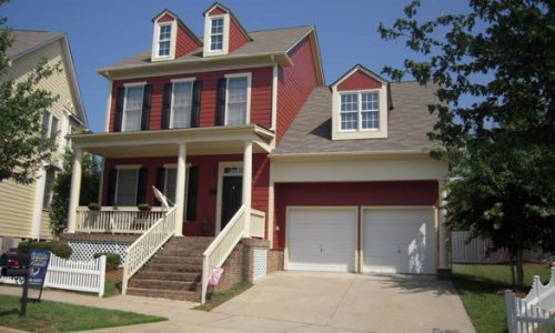 Deep Red Lap Siding, Cream Portico, and Black Shutter Painting