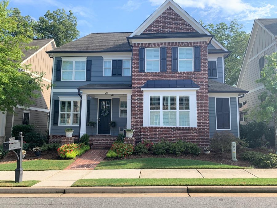 brick and siding colonial home painted blue and white by marietta exterior painters