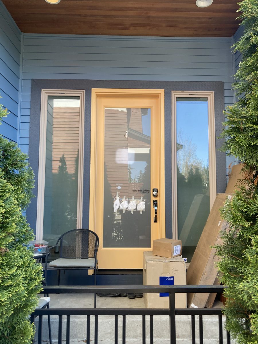 yellow painted door of blue house Preview Image 1