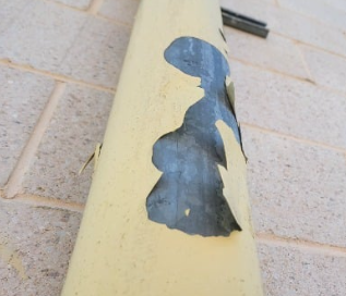 Costco electrical unit showing paint chipping (BEFORE)