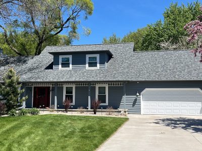 smoky blue stained wooden house siding