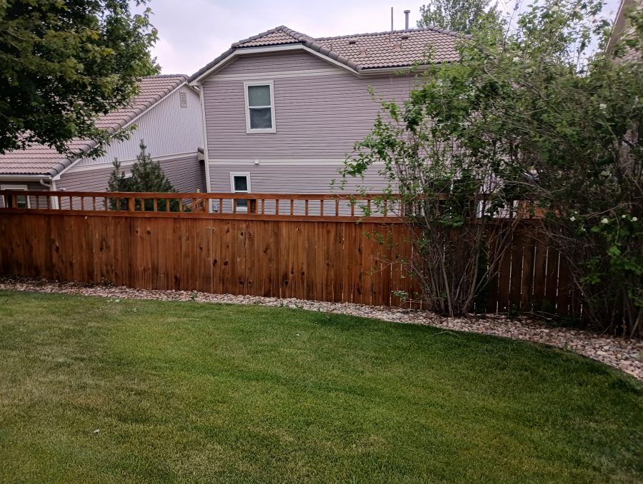 stained fence surrounding home and yard Preview Image 1