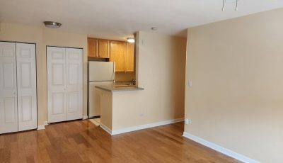 beige and white painted condo interior living room