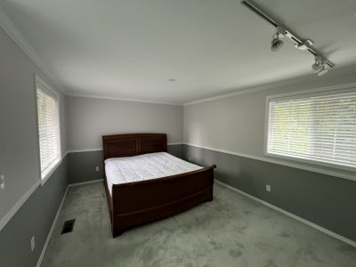 freshly painted bedroom with two tones and white trim