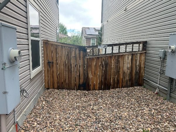 unstained fence surrounding home and yard Preview Image 7