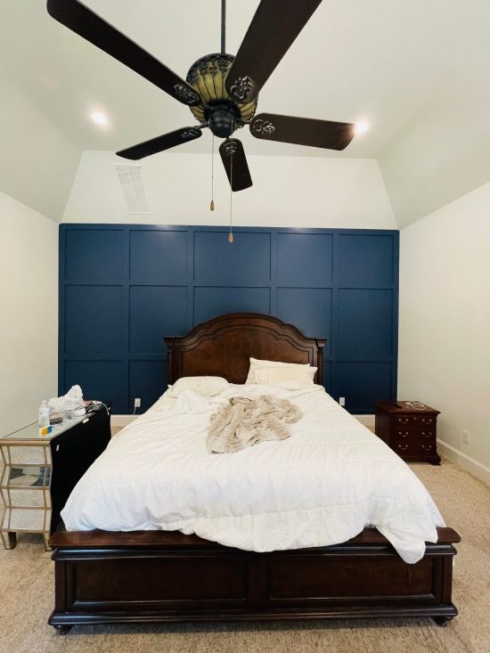 bedroom with blue accent wall