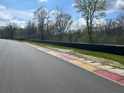 CertaPro painting the two metal crash walls at Road America