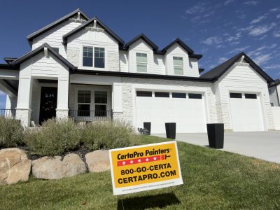 house exterior with white painted stucco and limewashed stone
