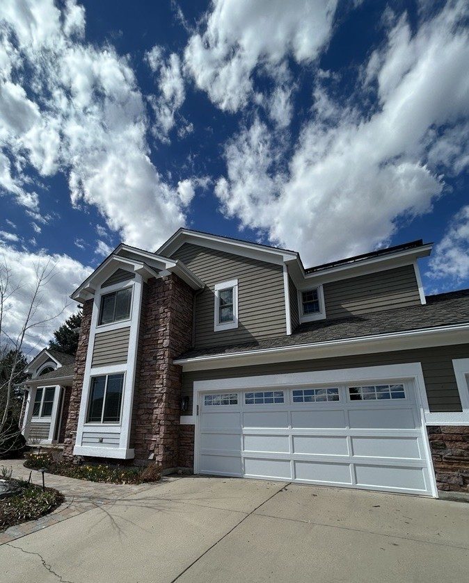 front exterior of house with stone and painted siding | garage view Preview Image 7