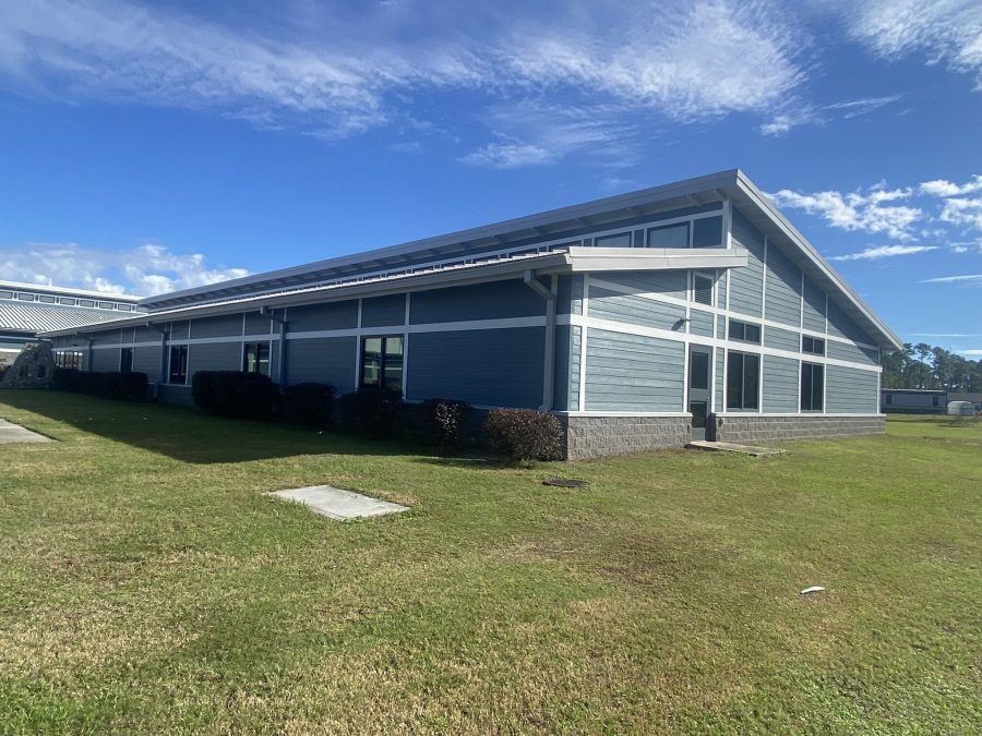 side view of blue exterior commercial building after painting Preview Image 3