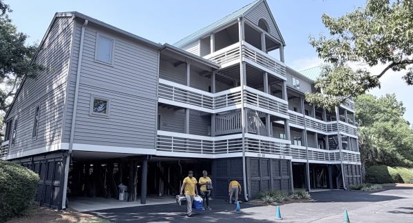 grey painted multifamily building with white trim