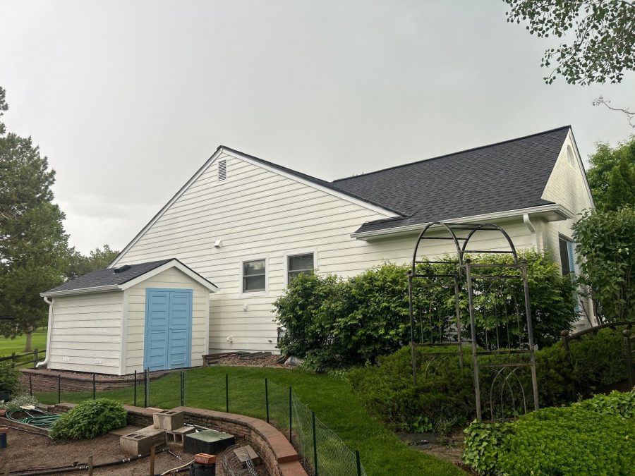 white painted brick home with light blue painted garage doors Preview Image 1