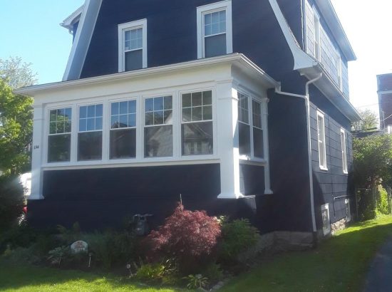 house with asbestos siding freshly painted