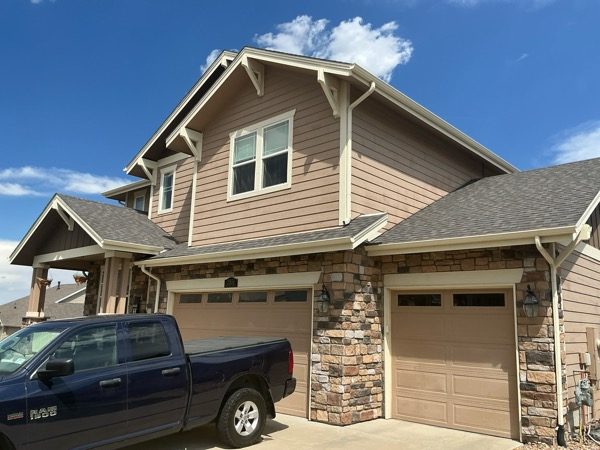 Before exterior color change showing the front exterior and garage of a Castle Rock home Preview Image 5