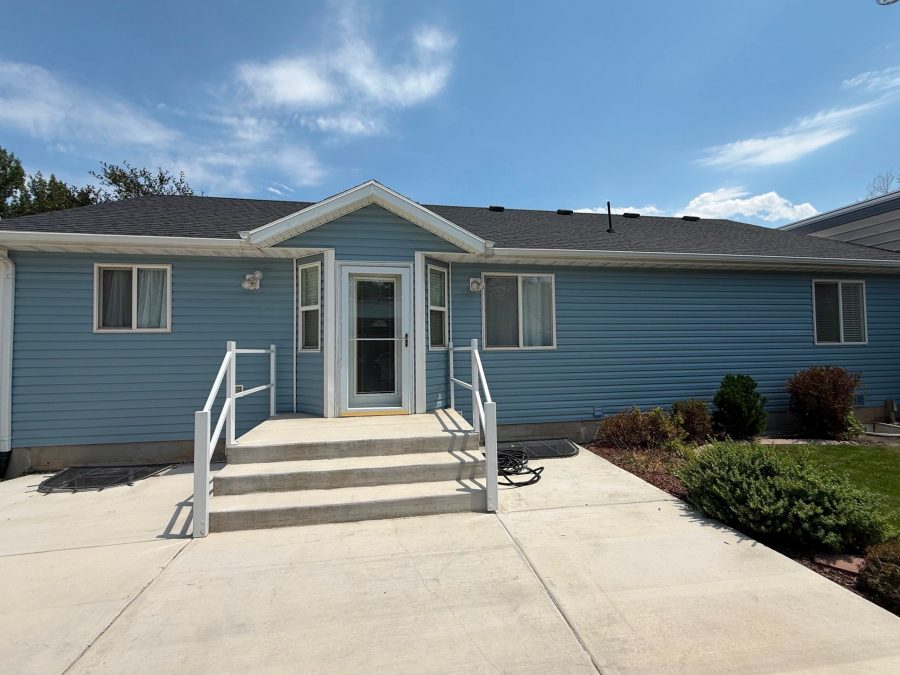 House exterior with painted blue siding and white trim Preview Image 5