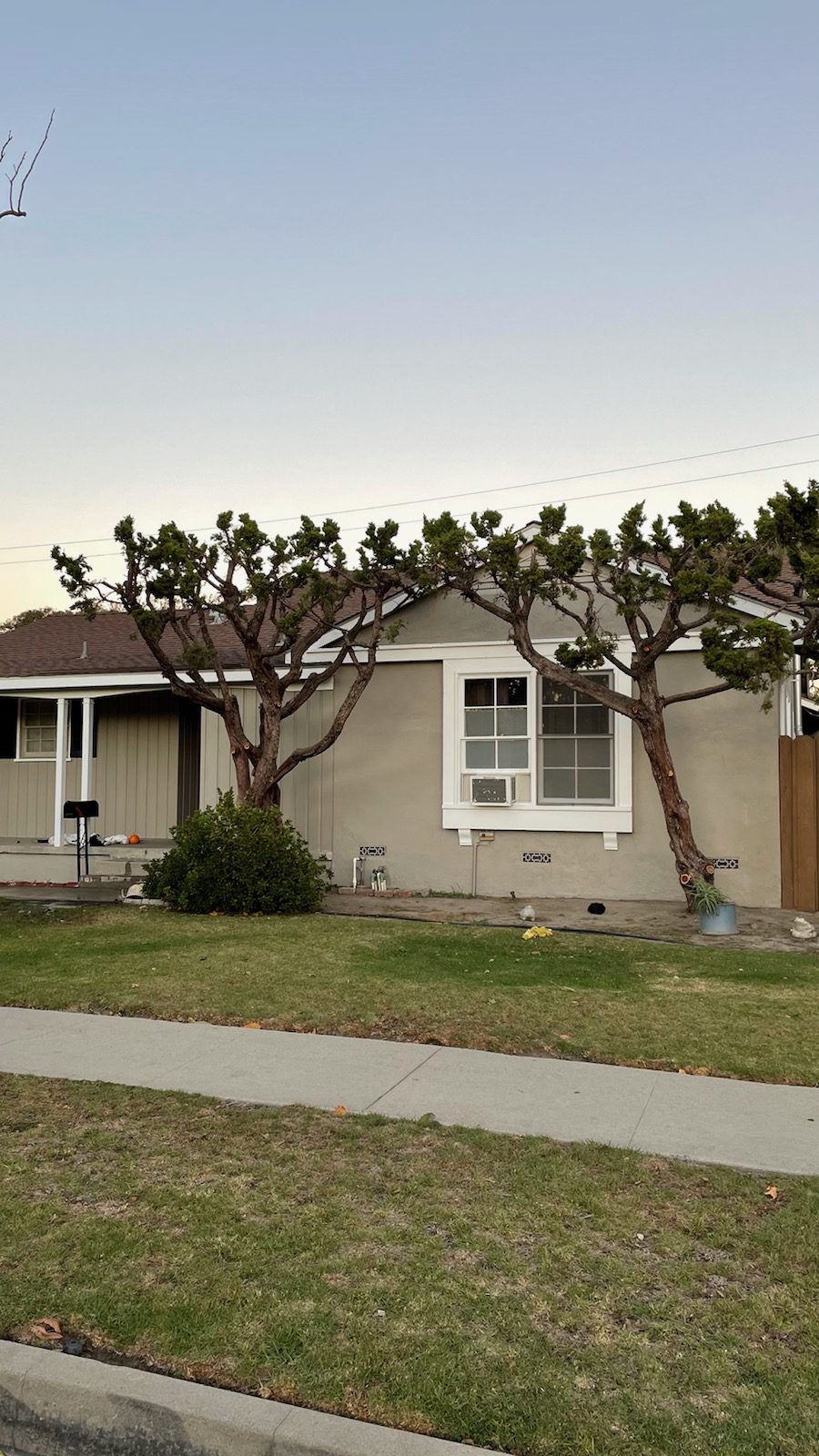 Taupe colored house with white trim after being painted. Preview Image 5