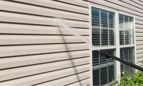 preparing a house's exterior for painting
