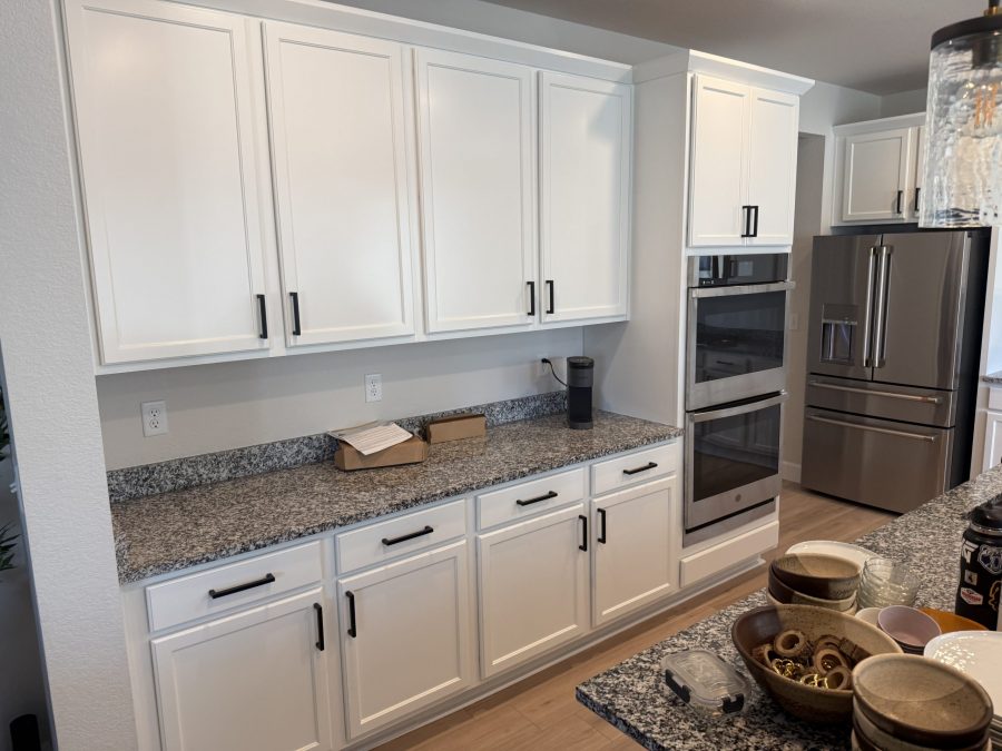white painted kitchen cabinets with black hardware after repaint Preview Image 1