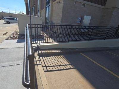 parking lot and sidewalk in front of commercial building