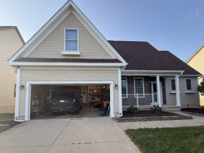 house exterior with off white siding and white trim and railing accents
