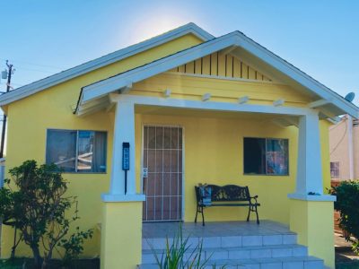 yellow house with light blue trim.