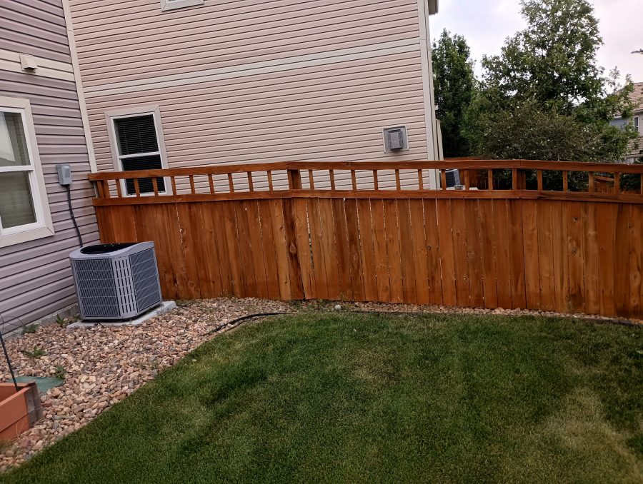 stained fence surrounding home and yard Preview Image 3