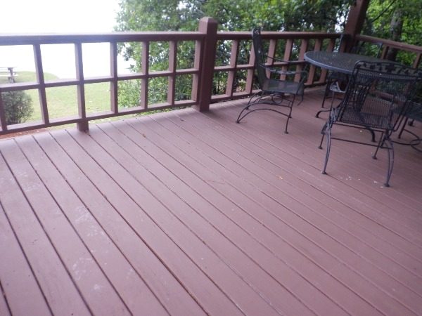 wooden deck floor and side railing with patio furniture Preview Image 11