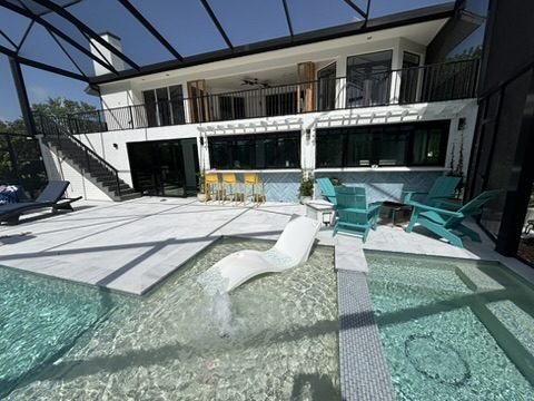 back patio and covered pool area of house