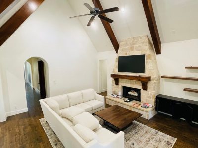 living room with vaulted ceiling and fireplace