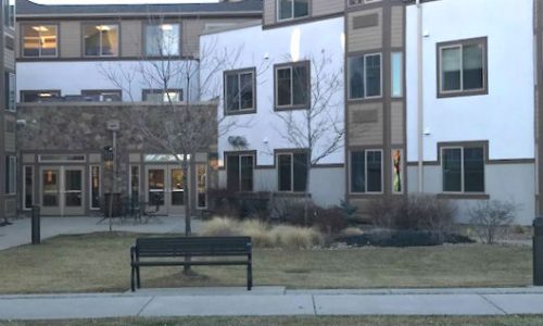 Multi-Story White and Taupe Exterior Repaint