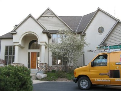 Exterior painting by CertaPro house painters in Forest Hills, MI