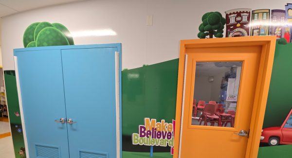 preschool hallway with colorfully painted classroom doors