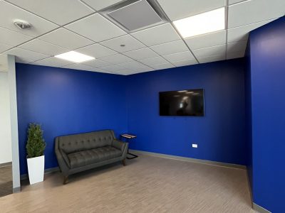 couch and tv in office space