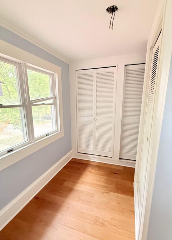 blue painted home interior room with wood floors