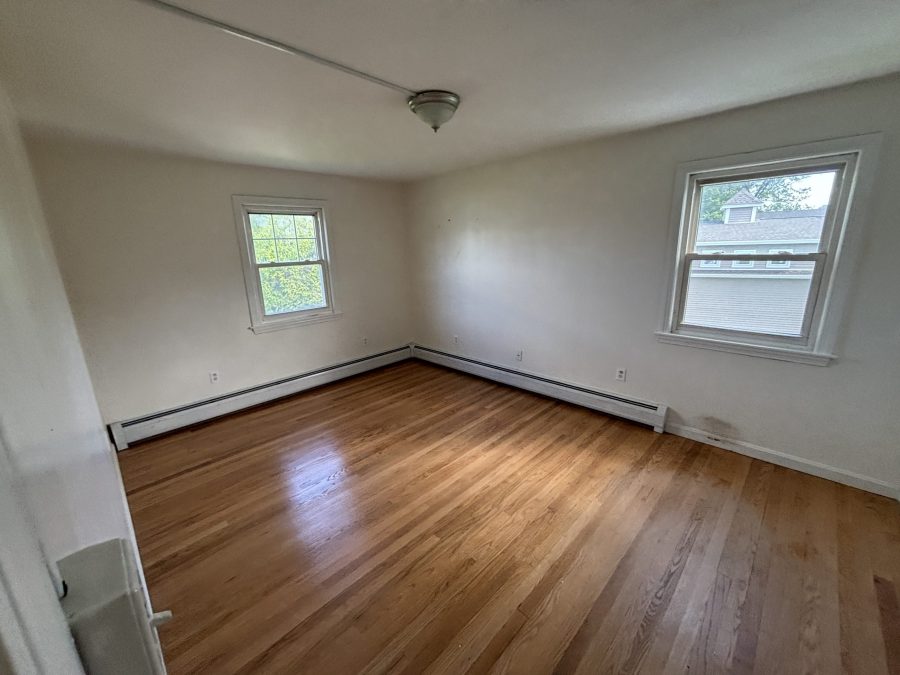 interior room in house with wooden floors and dirty and worn paint on walls Preview Image 11