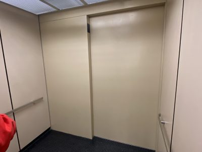 beige painted elevator interior