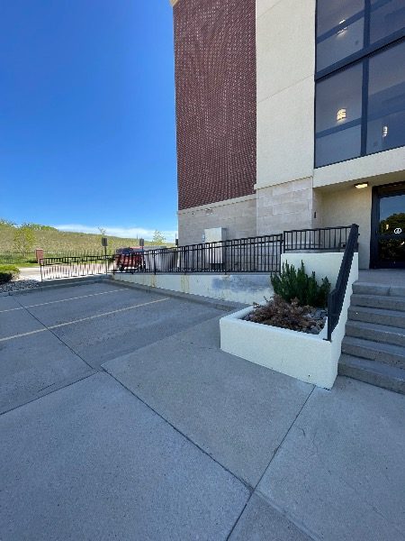 sidewalk in front of brick exterior commercial building Preview Image 2