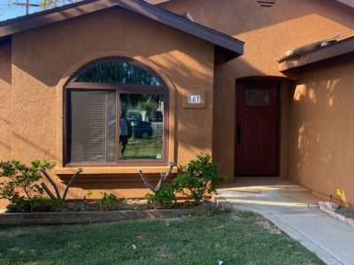 Front of stucco house showing the dark umber color choice.